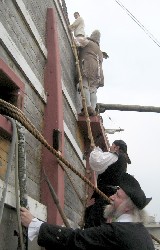 Climbing up the side of the ship